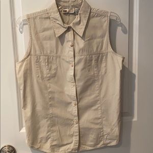 Khaki button up, sleeveless shirt.